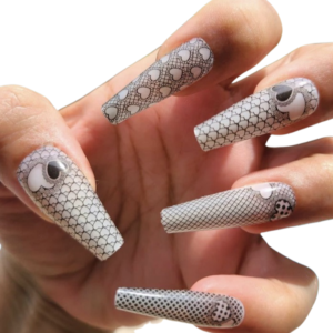 black overlay hearts pattern nail wrap over long white nails