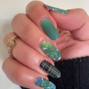 green clover and tartan nail wraps on long nails